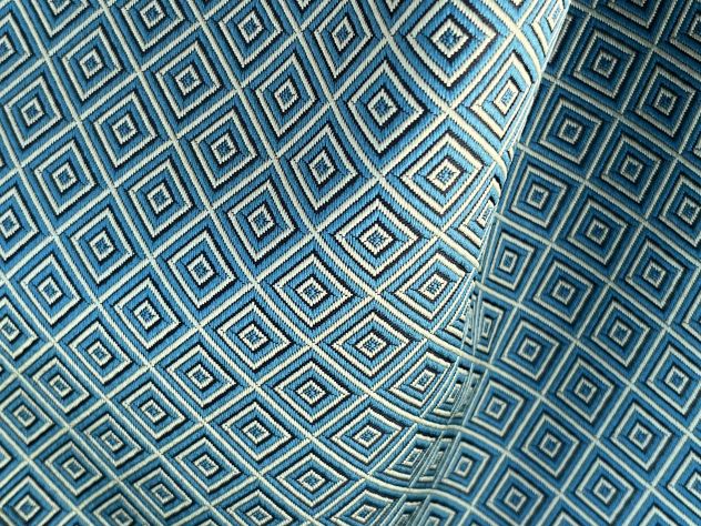 Scampolo tessuto a rombi avorio e verde per rivestimento