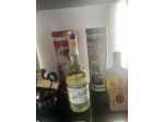 Importante quantitativo di bottiglie di liquore antiche.