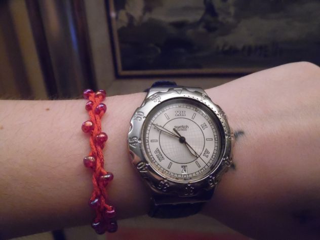 UN OROLOGIO COME NUOVO,ORIGINALE MARCA"SWATCH"CON CINTURINO IN VERA PELLE,VINTAG