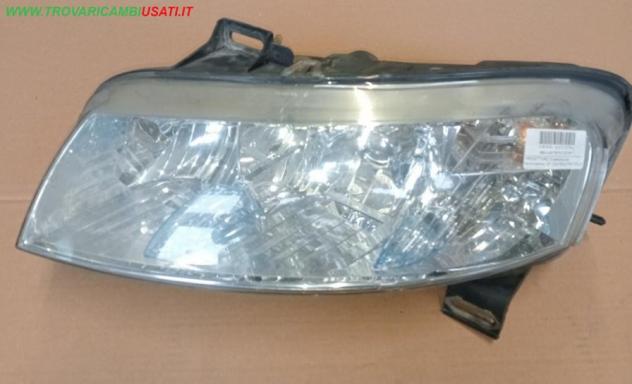 PROIETTORE SX(Vers.con fendinebbia) 5P. CON FENDI FIAT STILO (192-2C/2V) 517127160  Parti elettriche  Fanaleria  Proiettori  Proiettore ant. FIAT - ST