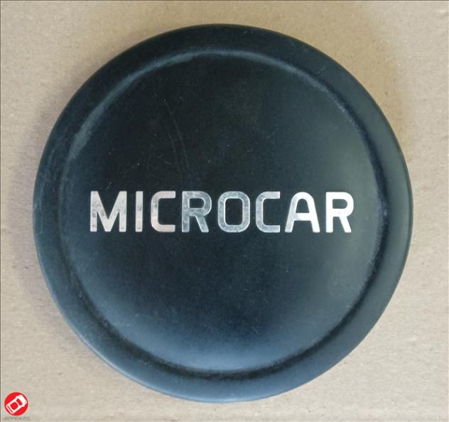 1408352 LOGO COPRICERCHIO NERO MICROCAR M.CROSS DUE' M.GO 3 4 5