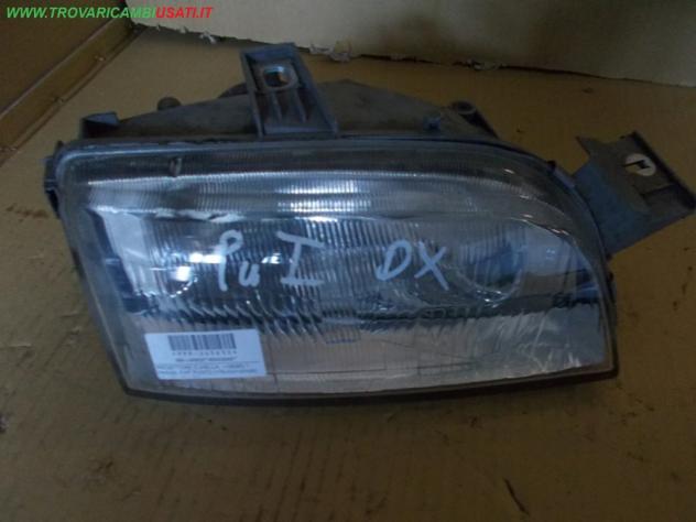 PROIETTORE D.(HELLA, -06/95) 1 PARAB. FIAT PUNTO (176-NV/1A/NW) 55 / 60 / 85 / GT  Parti elettriche  Fanaleria  Proiettori  Proiettore ant. FIAT - PUN