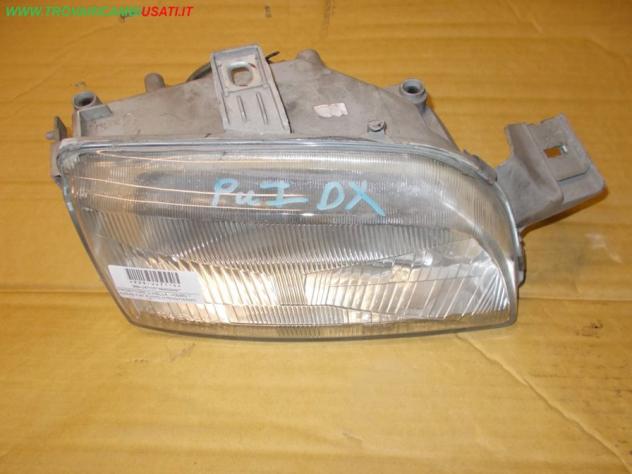 PROIETTORE D.(HELLA, -06/95) 1 PARAB FIAT PUNTO (176-NV/1A/NW) 55 / 60 / 85 / GT  Parti elettriche  Fanaleria  Proiettori  Proiettore ant. FIAT - PUNT