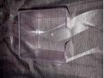 porta biglietti a forma di cubo in plastica.
