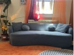 Divano Menzzo 4 posti design curvo bouclé blu petrolio - come nuovo