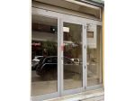 Porta con vetrata in alluminio per attività com.le