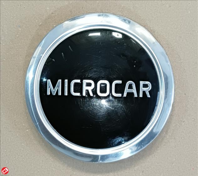 1401584 LOGO COPRICERCHIO MICROCAR M8 M.GO 3 4 5 FLEX DUE' 3 5 P85