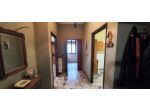Appartamento in bifamiliare con garage e piccolo terreno