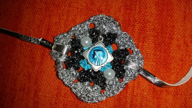 BRACCIALE TRICOT CON CIONDOLO - Foto 8
