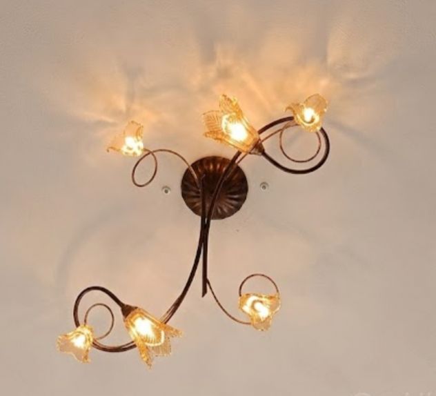 Tris di lampadari classico in ferro battuto con vetro ambrato