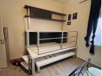 Struttura scrivania rialzata + letto + libreria