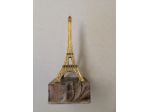 Torre Eiffel miniatura in plastica color oro, base in plastica color marmo 1982.