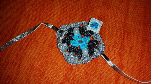 BRACCIALE TRICOT CON CIONDOLO - Foto 7
