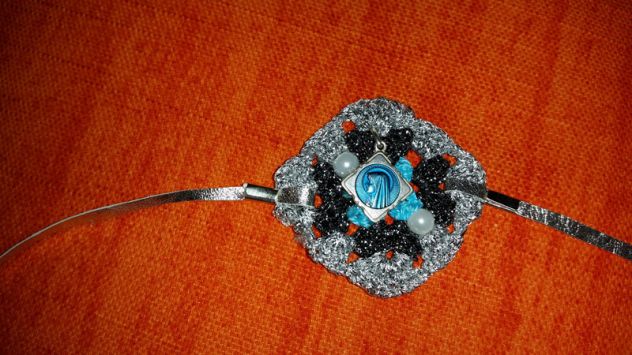 BRACCIALE TRICOT CON CIONDOLO - Foto 4