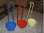 Portaposate metallici dipinti, lotto di tre.