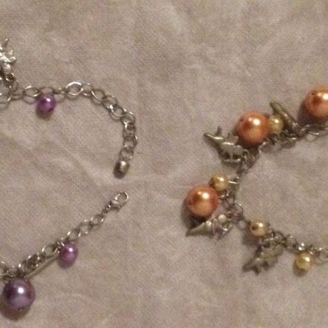 BRACCIALETTI CON CIONDOLI PENDENTI 2 pz.