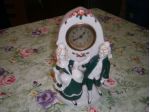 STATUETTA CON OROLOGIO