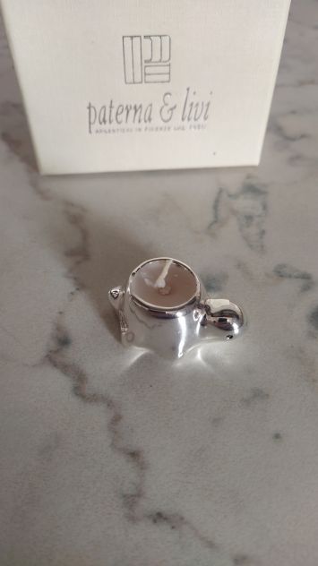 Tartaruga in argento con candela